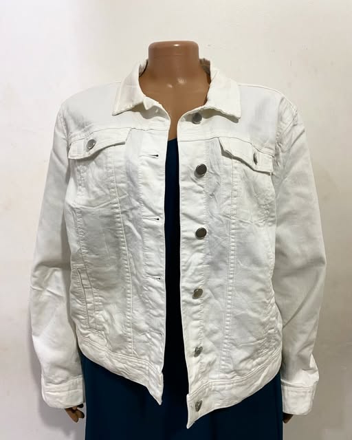 White denim jacket shown on a mannequin at TAG-her
