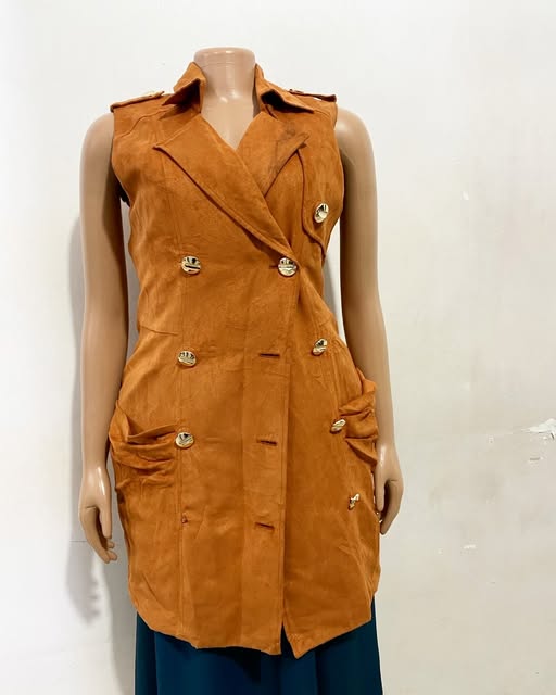 Ochre double-button vest shown on a mannequin at TAG-her
