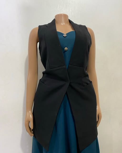 Black open-front vest shown on a mannequin at TAG-her