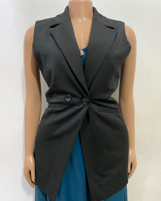 Black buttoned vest shown on a mannequin at TAG-her
