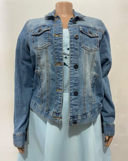 Blue denim jacket shown on a mannequin at TAG-her